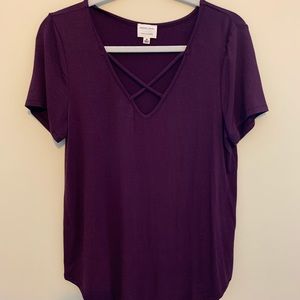 Purple shirt with open criss cross in the front
